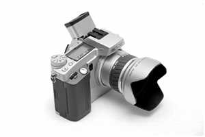 Minolta Dimage 5 (2002) - digitale 3 MP Brigde, 35-250mm, mit SLR-Feeling, wegen extrem langsamen Autofokus Wechsel auf die 7i